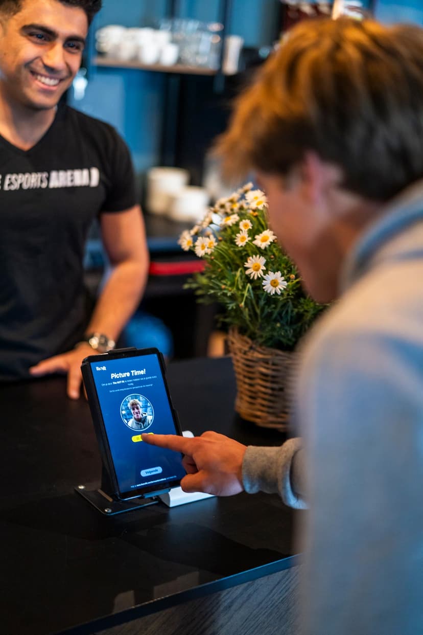 People signing up at NXT Fit tablet